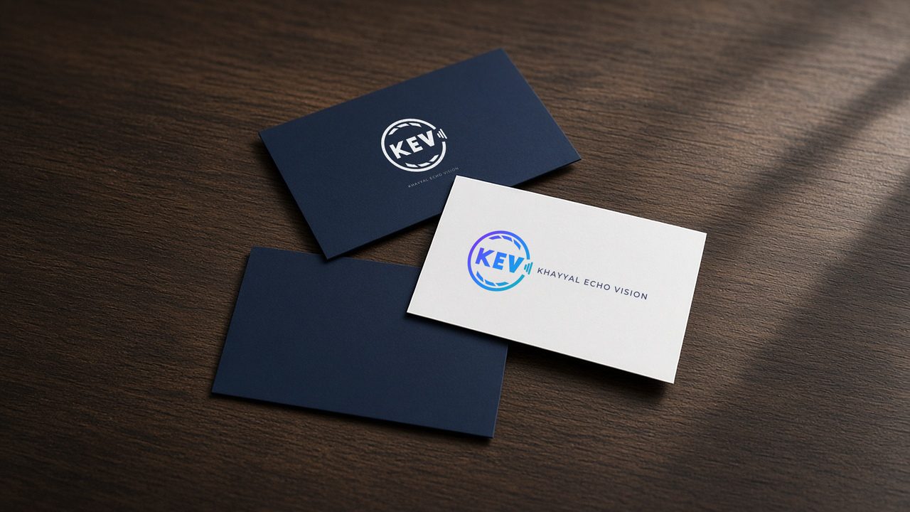 KEV business cards on a wooden desk